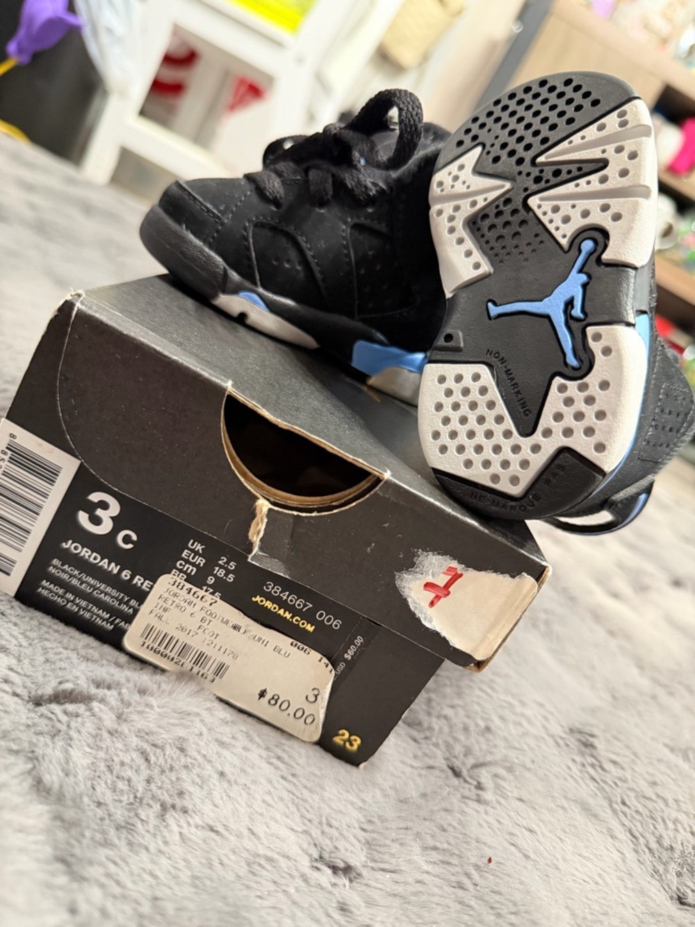 Jordan 6 Retro Black and university Blue Sneakers